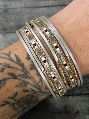 7.5" in length (7" fastened), the Neutral Metallic Leather Wrap Bracelet